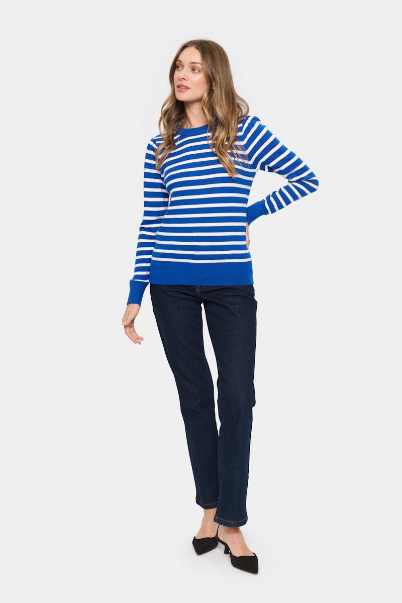 Striped blue sweater with black jeans
